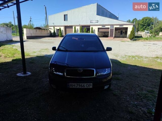 Черный Шкода Фабия, объемом двигателя 1.4 л и пробегом 290 тыс. км за 4500 $, фото 1 на Automoto.ua