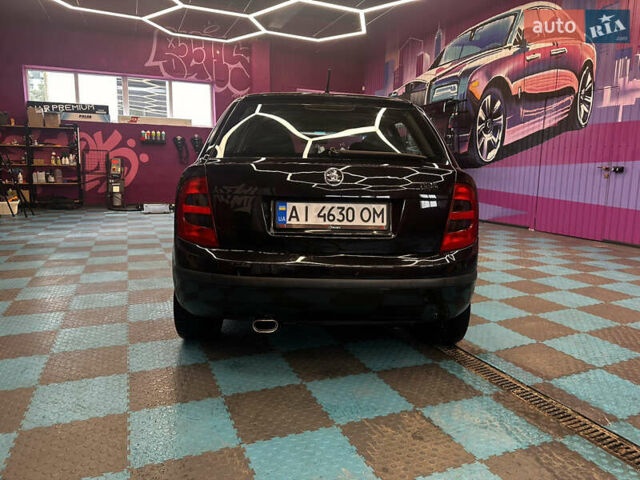 Черный Шкода Фабия, объемом двигателя 1.39 л и пробегом 275 тыс. км за 3999 $, фото 16 на Automoto.ua