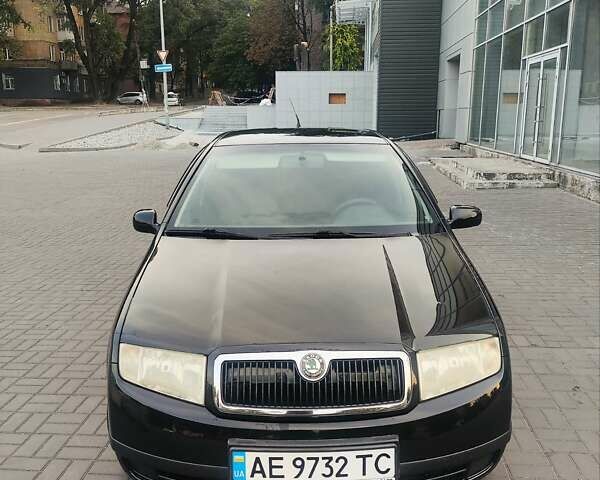 Черный Шкода Фабия, объемом двигателя 1.39 л и пробегом 280 тыс. км за 4600 $, фото 4 на Automoto.ua