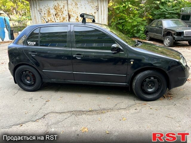 Черный Шкода Фабия, объемом двигателя 1.9 л и пробегом 290 тыс. км за 3300 $, фото 2 на Automoto.ua