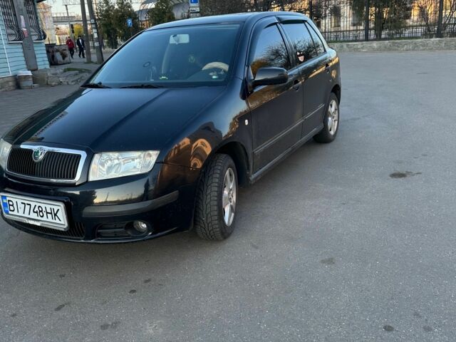 Черный Шкода Фабия, объемом двигателя 1.4 л и пробегом 245 тыс. км за 4000 $, фото 1 на Automoto.ua