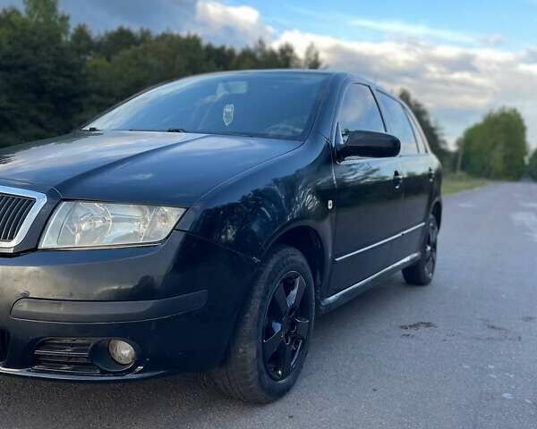 Черный Шкода Фабия, объемом двигателя 1.2 л и пробегом 260 тыс. км за 2600 $, фото 1 на Automoto.ua