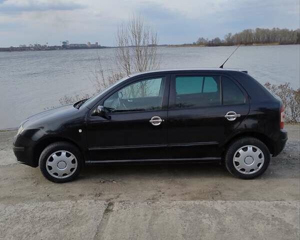 Черный Шкода Фабия, объемом двигателя 1.39 л и пробегом 177 тыс. км за 3900 $, фото 6 на Automoto.ua