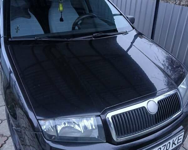 Черный Шкода Фабия, объемом двигателя 1.2 л и пробегом 313 тыс. км за 2700 $, фото 3 на Automoto.ua