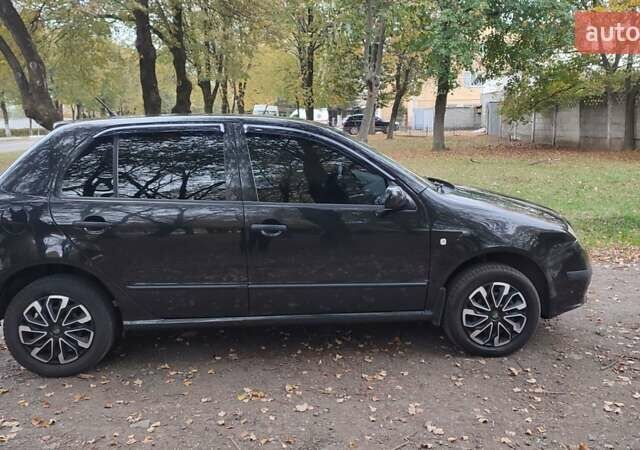 Черный Шкода Фабия, объемом двигателя 1.2 л и пробегом 234 тыс. км за 4200 $, фото 5 на Automoto.ua