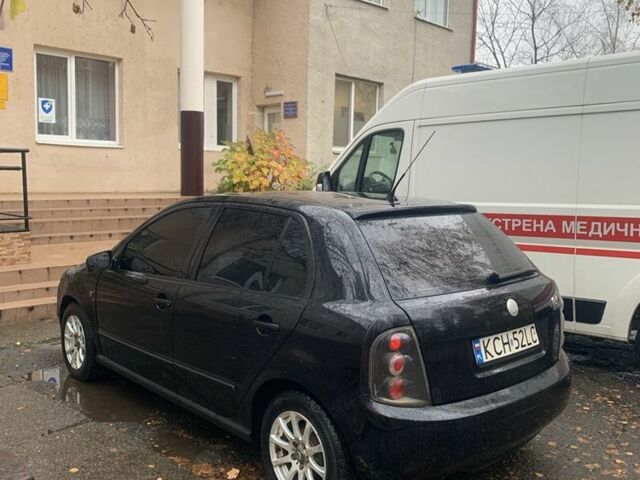 Черный Шкода Фабия, объемом двигателя 1.4 л и пробегом 210 тыс. км за 1600 $, фото 2 на Automoto.ua