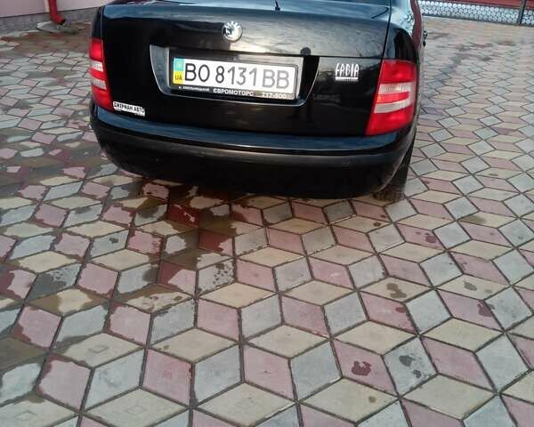 Черный Шкода Фабия, объемом двигателя 1.2 л и пробегом 112 тыс. км за 3600 $, фото 1 на Automoto.ua