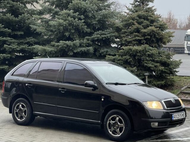 Черный Шкода Фабия, объемом двигателя 1.4 л и пробегом 289 тыс. км за 3470 $, фото 2 на Automoto.ua