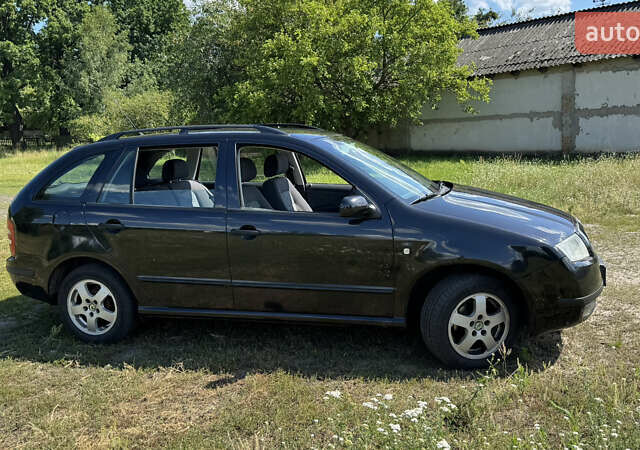 Черный Шкода Фабия, объемом двигателя 1.4 л и пробегом 214 тыс. км за 3700 $, фото 2 на Automoto.ua