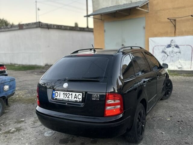 Черный Шкода Фабия, объемом двигателя 1.4 л и пробегом 290 тыс. км за 4400 $, фото 4 на Automoto.ua