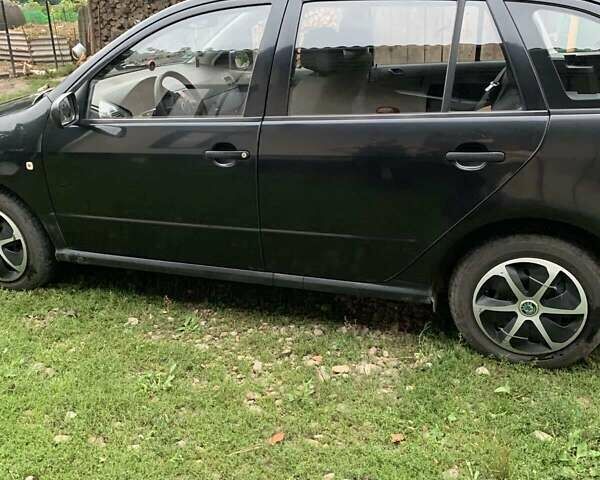 Черный Шкода Фабия, объемом двигателя 1.39 л и пробегом 264 тыс. км за 3600 $, фото 4 на Automoto.ua