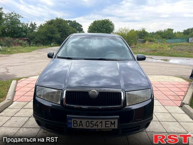 Черный Шкода Фабия, объемом двигателя 1.4 л и пробегом 186 тыс. км за 4100 $, фото 1 на Automoto.ua