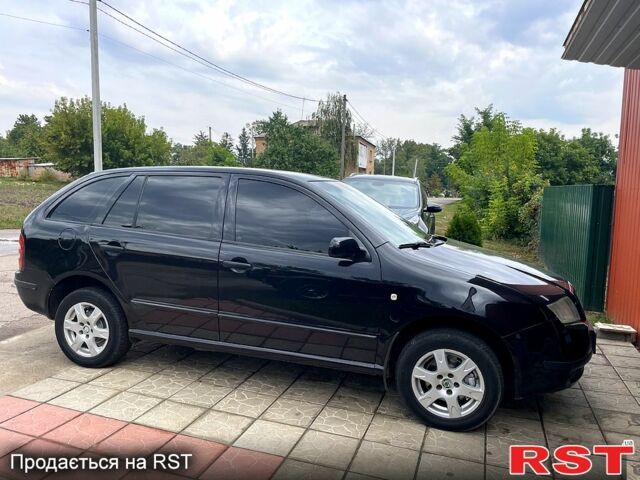 Черный Шкода Фабия, объемом двигателя 1.4 л и пробегом 186 тыс. км за 4100 $, фото 2 на Automoto.ua