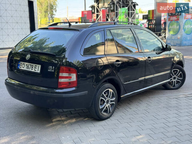 Черный Шкода Фабия, объемом двигателя 1.39 л и пробегом 255 тыс. км за 3750 $, фото 3 на Automoto.ua