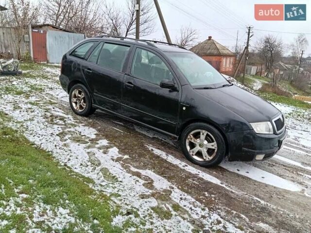 Черный Шкода Фабия, объемом двигателя 1.4 л и пробегом 205 тыс. км за 2958 $, фото 1 на Automoto.ua