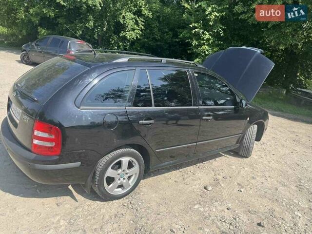 Черный Шкода Фабия, объемом двигателя 1.39 л и пробегом 226 тыс. км за 4600 $, фото 7 на Automoto.ua