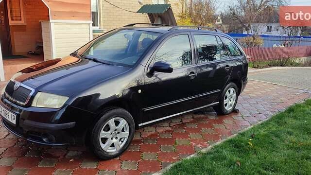 Черный Шкода Фабия, объемом двигателя 1.4 л и пробегом 387 тыс. км за 3500 $, фото 1 на Automoto.ua