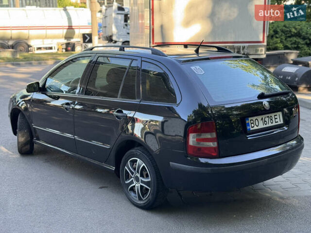Черный Шкода Фабия, объемом двигателя 1.39 л и пробегом 255 тыс. км за 3750 $, фото 1 на Automoto.ua