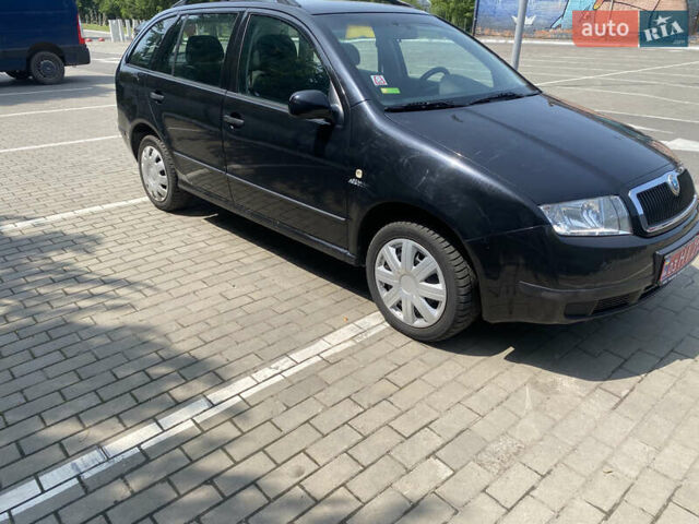 Черный Шкода Фабия, объемом двигателя 1.4 л и пробегом 219 тыс. км за 3750 $, фото 4 на Automoto.ua
