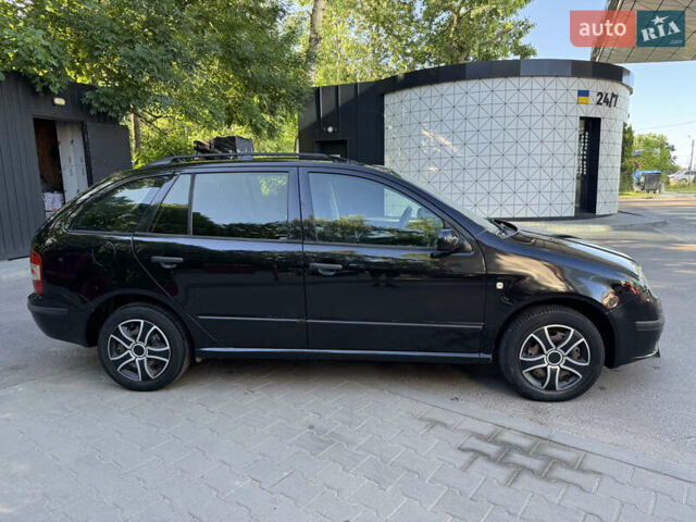 Черный Шкода Фабия, объемом двигателя 1.39 л и пробегом 255 тыс. км за 3750 $, фото 13 на Automoto.ua