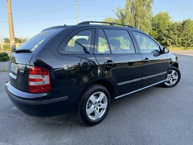 Черный Шкода Фабия, объемом двигателя 1.4 л и пробегом 300 тыс. км за 3900 $, фото 5 на Automoto.ua