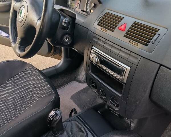 Черный Шкода Фабия, объемом двигателя 1.39 л и пробегом 240 тыс. км за 5000 $, фото 16 на Automoto.ua