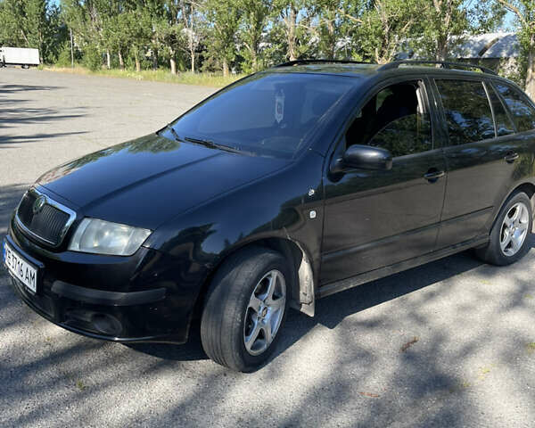 Черный Шкода Фабия, объемом двигателя 1.4 л и пробегом 328 тыс. км за 4500 $, фото 9 на Automoto.ua