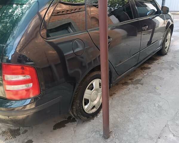 Черный Шкода Фабия, объемом двигателя 1.39 л и пробегом 227 тыс. км за 4000 $, фото 2 на Automoto.ua