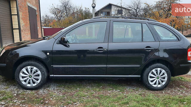 Черный Шкода Фабия, объемом двигателя 1.39 л и пробегом 168 тыс. км за 4600 $, фото 12 на Automoto.ua