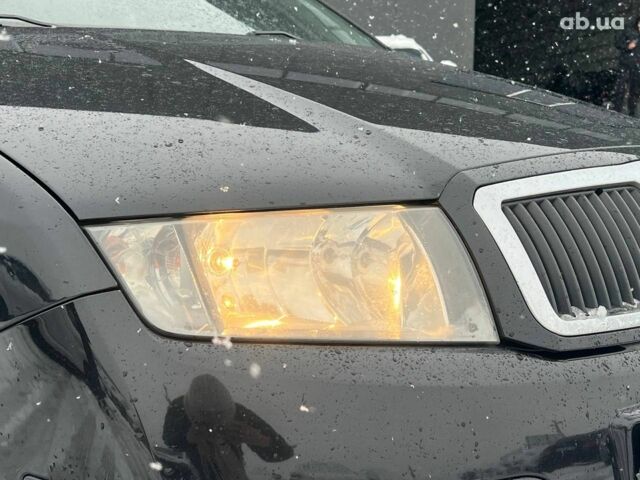 Черный Шкода Фабия, объемом двигателя 1.4 л и пробегом 276 тыс. км за 5440 $, фото 12 на Automoto.ua