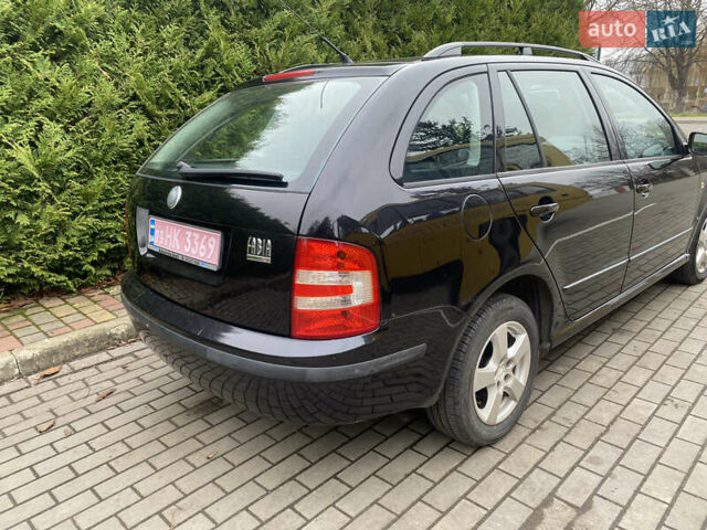 Черный Шкода Фабия, объемом двигателя 1.4 л и пробегом 246 тыс. км за 4399 $, фото 2 на Automoto.ua