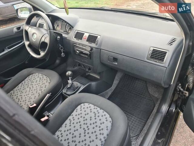 Черный Шкода Фабия, объемом двигателя 1.4 л и пробегом 196 тыс. км за 4699 $, фото 5 на Automoto.ua