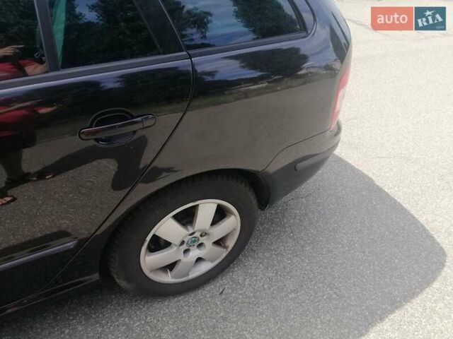 Черный Шкода Фабия, объемом двигателя 1.4 л и пробегом 235 тыс. км за 4700 $, фото 49 на Automoto.ua