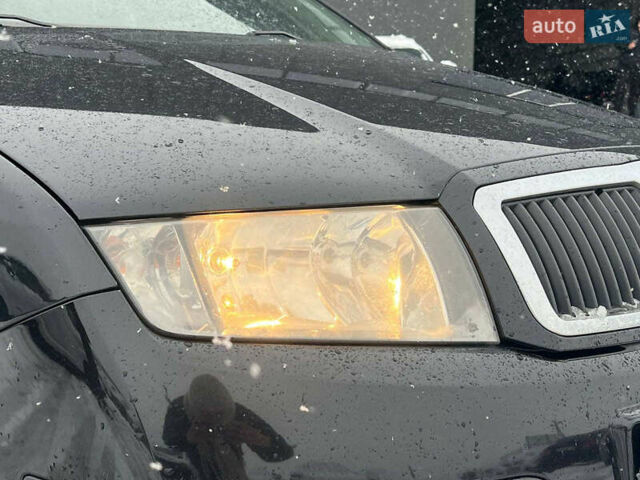 Черный Шкода Фабия, объемом двигателя 1.4 л и пробегом 276 тыс. км за 5440 $, фото 12 на Automoto.ua