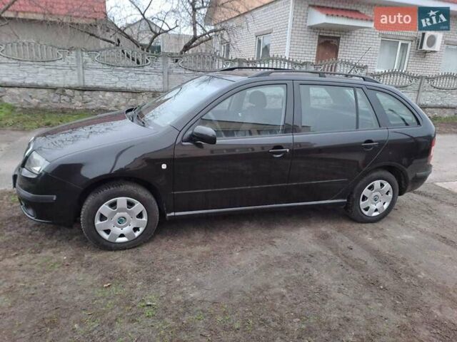 Черный Шкода Фабия, объемом двигателя 1.39 л и пробегом 151 тыс. км за 4500 $, фото 2 на Automoto.ua