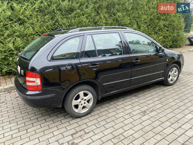Черный Шкода Фабия, объемом двигателя 1.4 л и пробегом 246 тыс. км за 4399 $, фото 5 на Automoto.ua