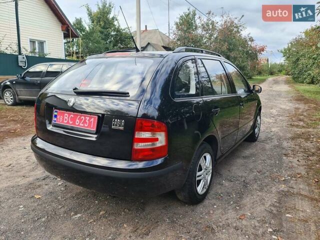 Черный Шкода Фабия, объемом двигателя 1.4 л и пробегом 196 тыс. км за 4699 $, фото 2 на Automoto.ua