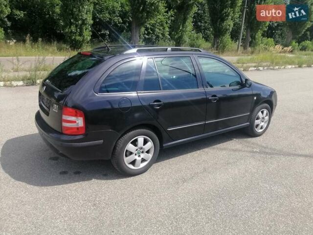 Черный Шкода Фабия, объемом двигателя 1.4 л и пробегом 235 тыс. км за 4700 $, фото 11 на Automoto.ua