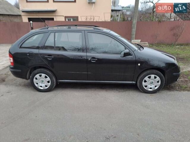 Черный Шкода Фабия, объемом двигателя 1.39 л и пробегом 151 тыс. км за 4500 $, фото 1 на Automoto.ua