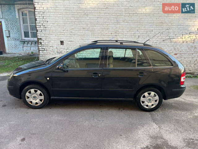 Черный Шкода Фабия, объемом двигателя 1.4 л и пробегом 270 тыс. км за 4400 $, фото 4 на Automoto.ua