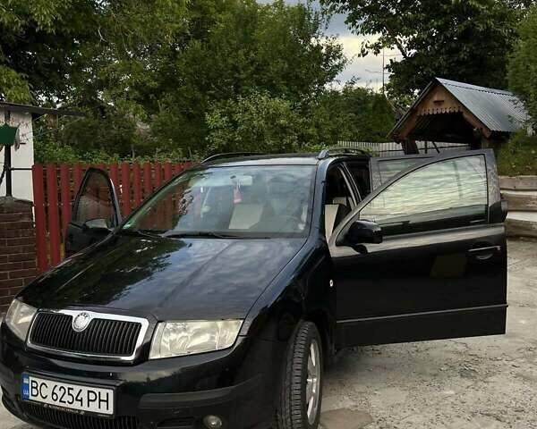 Черный Шкода Фабия, объемом двигателя 1.39 л и пробегом 220 тыс. км за 4650 $, фото 6 на Automoto.ua