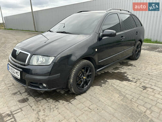 Черный Шкода Фабия, объемом двигателя 1.39 л и пробегом 226 тыс. км за 3900 $, фото 2 на Automoto.ua