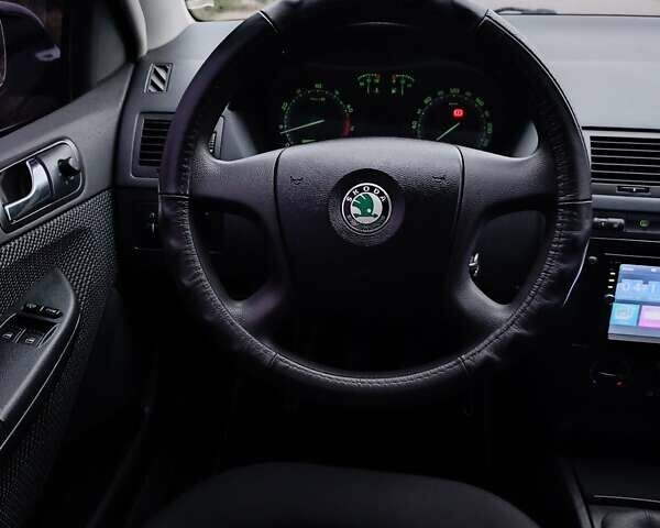 Черный Шкода Фабия, объемом двигателя 1.39 л и пробегом 193 тыс. км за 5500 $, фото 29 на Automoto.ua