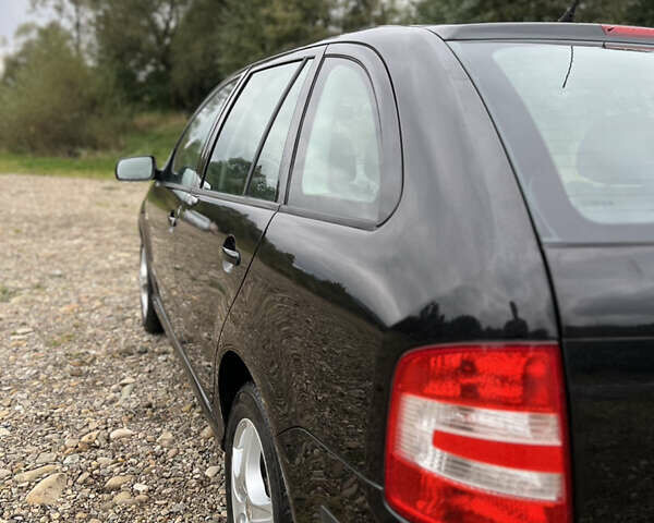 Черный Шкода Фабия, объемом двигателя 1.4 л и пробегом 220 тыс. км за 4450 $, фото 11 на Automoto.ua