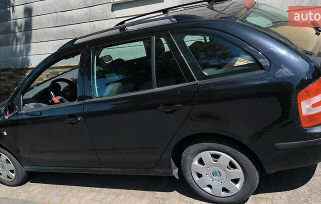 Черный Шкода Фабия, объемом двигателя 1.4 л и пробегом 230 тыс. км за 3850 $, фото 14 на Automoto.ua