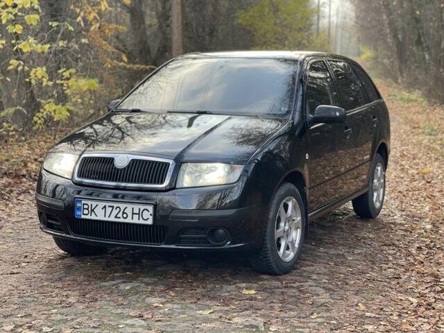 Черный Шкода Фабия, объемом двигателя 1.2 л и пробегом 380 тыс. км за 3100 $, фото 1 на Automoto.ua