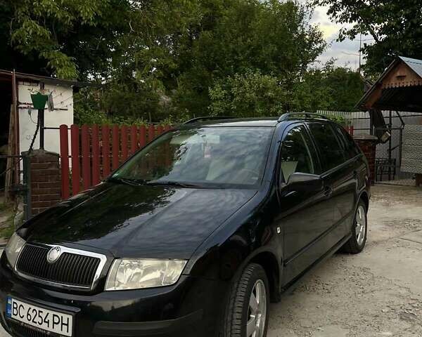 Черный Шкода Фабия, объемом двигателя 1.39 л и пробегом 220 тыс. км за 4650 $, фото 5 на Automoto.ua