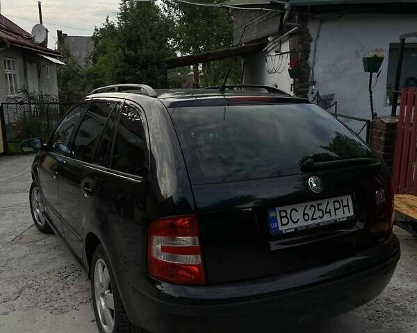 Черный Шкода Фабия, объемом двигателя 1.39 л и пробегом 220 тыс. км за 4650 $, фото 7 на Automoto.ua