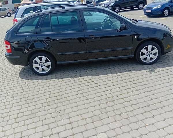 Черный Шкода Фабия, объемом двигателя 1.4 л и пробегом 200 тыс. км за 4550 $, фото 3 на Automoto.ua