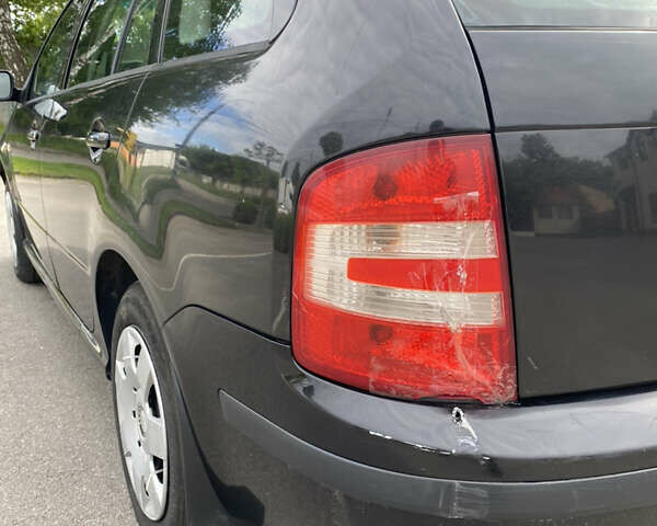 Черный Шкода Фабия, объемом двигателя 1.4 л и пробегом 272 тыс. км за 3900 $, фото 4 на Automoto.ua